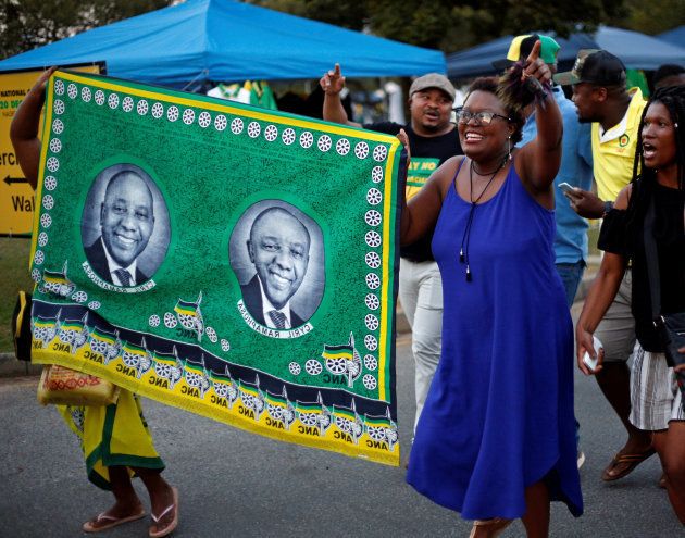 Supporters celebrate Cyril Ramaphosa being elected President of the African National Congress (ANC) at the gates of the Nasrec Expo Centre, where the 54th National Conference of the ruling party takes place, in Johannesburg, South Africa December 18, 2017. REUTERS/Rogan Ward