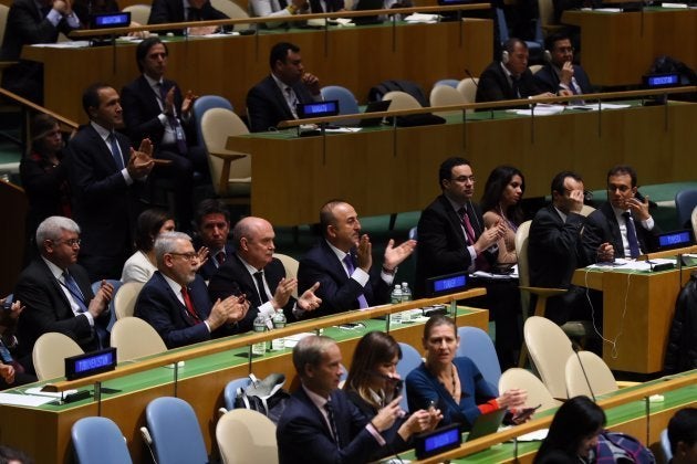 Turkish Foreign Minister Mevlut Cavusoglu applauds after voting results during the emergency special session over Jerusalem held by UN General Assembly in New York, United States on December 21, 2017.