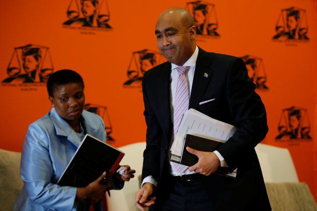 National Director of Public Prosecutions Shaun Abrahams (R) walks past his deputy Adv Nomgcobo Jiba as he leaves at the end of a media briefing in Pretoria, South Africa, May 23, 2016.