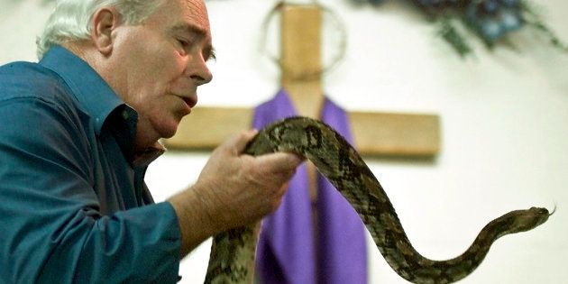 Snake handler Reverend Junior McCormick, a visiting preacher at the