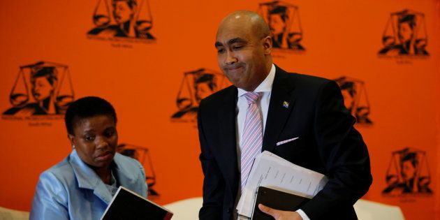 National Director of Public Prosecutions Shaun Abrahams (R) walks past Nomgcobo Jiba as he leaves at the end of a media briefing in Pretoria, South Africa, May 23, 2016.