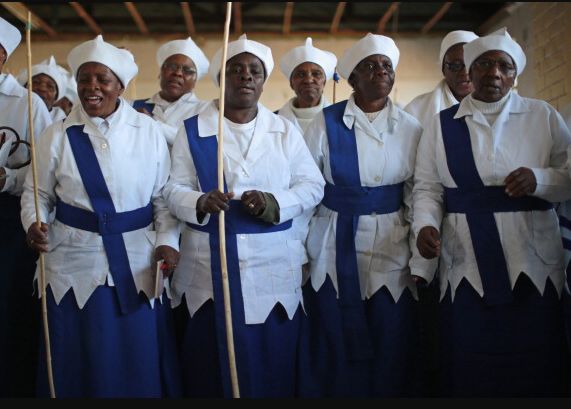 Women from the Gauteng Christian Catholic Apostolic Church take part in service which incorporates singing and prayers for the ailing of Nelson Mandela on 6 July 2013.