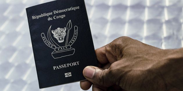 An immigration official displays a Congolese biometric passport in the Democratic Republic of Congo's capital Kinshasa, February 10, 2017. Picture taken February 10, 2017.
