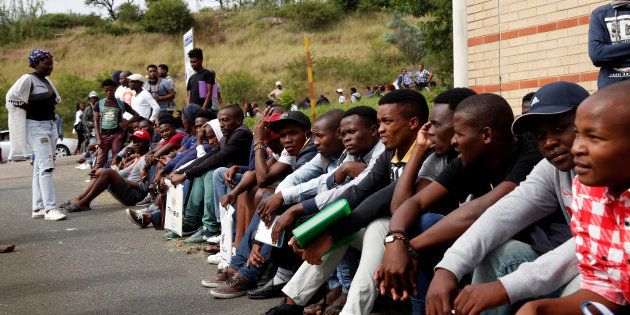 People queue to register for tertiary studies at Thekweni FET College in Durban, South Africa, January 18, 2017.