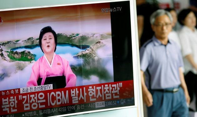 People watch a TV broadcast of a news report on North Korea's Hwasong-14 missile, a new intercontinental ballistic missile, which they said is successfully tested, at a railway station in Seoul, South Korea, July 4, 2017.