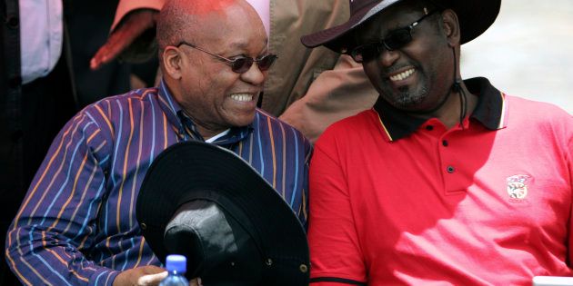 South Africa's President Jacob Zuma (L) chats with Zwelinzima Vavi (R).