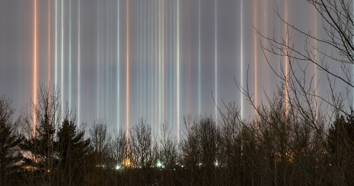 N.B.  Developer Snaps Stunning Photos Of Light Pillars In The Sky