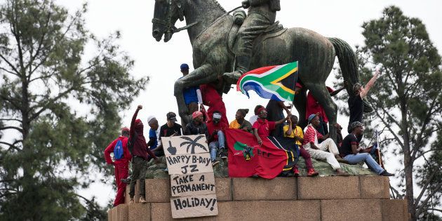 South African political party the E.F.F (Economic Freedom Fighters) supporters and other opposition activists gather in Pretoria, on April 12, 2017 ahead of a march calling for the ousting of the embattled President Jacob Zuma. President Jacob Zuma is facing pressure to step down following a controversial cabinet reshuffle and mass corruption charges.