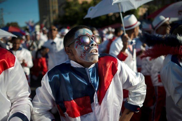 Members of minstrel troupes sing and dance as they march in the city centre during the annual Tweede Nuwe Jaar (Second New Year) Cape Town Minstrels Carnival on January 2, 2018, in Cape Town. The Tweede Nuwe Jaar (Second New Year) Cape Town Minstrels Carnival is a main event that see more than 40 troupes, and nearly 1,000 members, dressed with bright coloured costumes, and marching while playing music and dancing, through the centre of Cape Town. The Tweede Nuwe Jaar celebration dates back to the time before slavery was abolished in the Cape colony, during which slaves were allowed to relax on the day following New Years Day. These troupes also aim at creating social cohesion, activities for youth, and connection with culture in the mostly impoverished crime-ridden communities in which the members live.