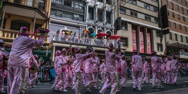 TOPSHOT - Hundreds of Cape Minstrels from different troops perform during the traditional Second New Year Parade on January 2, 2017 in the streets of central Cape Town, South Africa. instruments. / AFP / Mujahid SAFODIEN (Photo credit should read MUJAHID SAFODIEN/AFP/Getty Images)