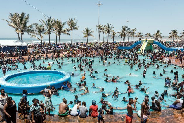 A general view taken on January 1, 2018 in Durban shows thousands of New Year party revelers and holiday makers gathering on the North Beach during New Year festivities.