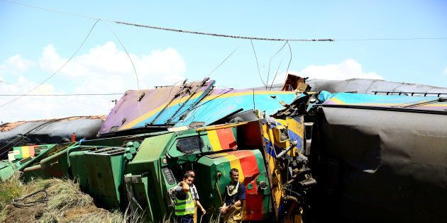 Workers next to a wreckage offter a train crash near Hennenman in Free State, January 4, 2018. REUTERS/Stringer TPX IMAGES OF THE DAY