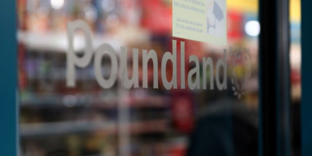 A Poundland logo sits at an entrance to a Poundland Group Ltd. discount retail store, operated by Steinhoff International Holdings.