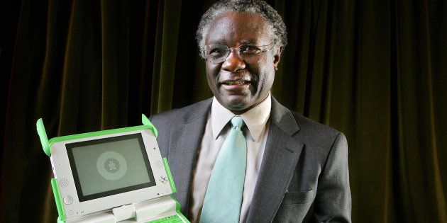 African development expert Professor Calestous Juma of Harvard University holds a waterproof $100 [~R1,250] computer, developed by the Massachusetts Institute of Technology with the aim of making computers available to all African children.