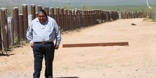 Verlon Jose, vice-chairman of the Tohono O'odham Nation, walks along the vehicle barrier on the U.S.-Mexico border on the Tohono O'odham reservation in Chukut Kuk, Arizona April 6, 2017.