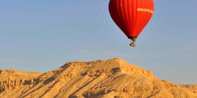 A hot air balloon flies over Luxor on April 21, 2013.