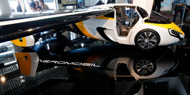 People look at the AeroMobil flying car during its unveiling at the Top Marques Monaco supercar show in Monaco April 20, 2017.