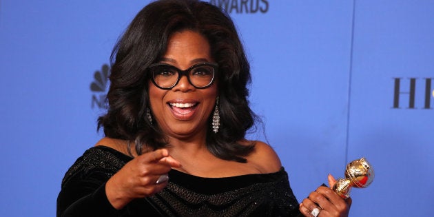 Oprah Winfrey poses backstage at the Golden Globes with her Cecil B. DeMille Award.