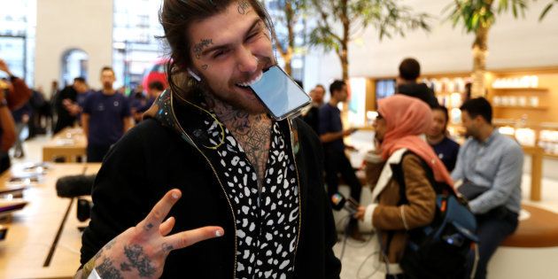 Marco Pierre White Jr shows his new phone, as he was the first to purchase the new Apple iPhone X at the Apple Store in Regents Street, London, Britain, November 3, 2017.