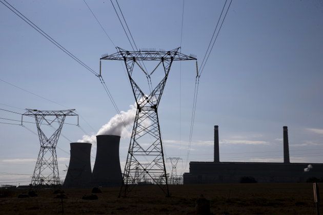 Electricity pylons are seen near Arnot Power Station's cooling towers, east of Middelburg in Mpumalanga province.