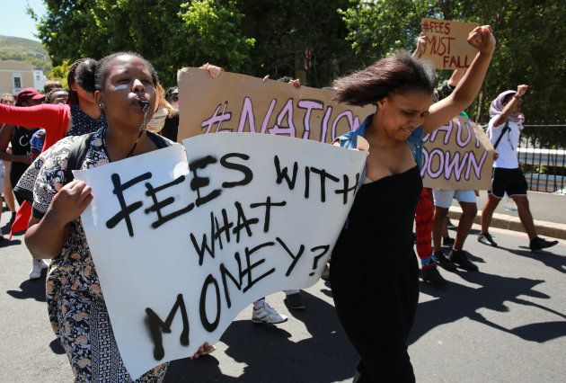 South African students protest outside the parliament precinct before forcing their way through the gates of parliament on October 21, 2015 in Cape Town, South Africa.