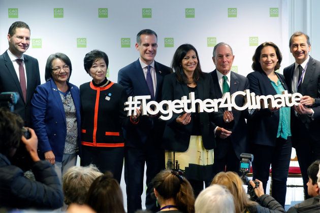 From L to R: Mauricio Rodas, mayor of Quito, Cape Town mayor Patricia de Lille, Tokyo governor Yuriko Koike, Los Angeles mayor Eric Garcetti, Paris mayor Anne Hidalgo, former New York City mayor and founder of Bloomberg L.P. Michael Bloomberg, Barcelona's mayor Ada Colau and Milan's mayor Giuseppe Sala pose together during a two-day summit of the C40 Cities initiative, a network of cities making plans to cut planet-warming greenhouse gas emissions along levels agreed upon in Paris two years ago, in Paris, France. October 23, 2017.