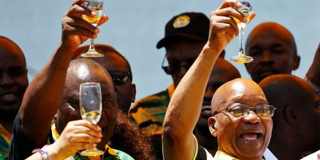 African National Congress (ANC) President Cyril Ramaphosa (L) celebrates the Congress' 106th anniversary celebrations with Kenyan President Uhuru Kenyatta (R) and South Africa President Jacob Zuma (C), in East London, South Africa, January 13, 2018.