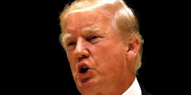 U.S. President Donald Trump speaks upon arrival for dinner at his golf club in West Palm Beach, Florida, U.S., January 14, 2018. REUTERS/Kevin Lamarque