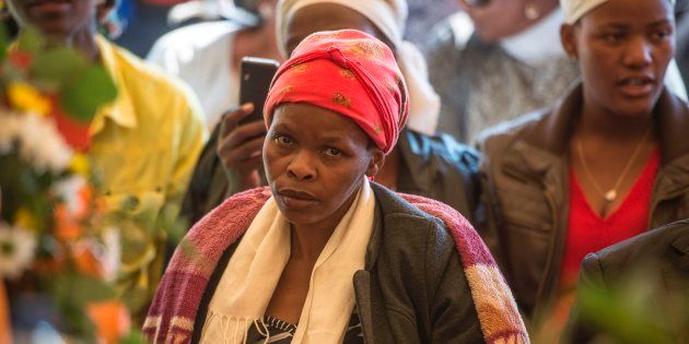 The mother of 16-year-old Matlhomola Moshoeu attends her son's burial at the Scotland extension 81 graveyard on May 7, 2017 in Coligny. (MUJAHID SAFODIEN/AFP/Getty Images)