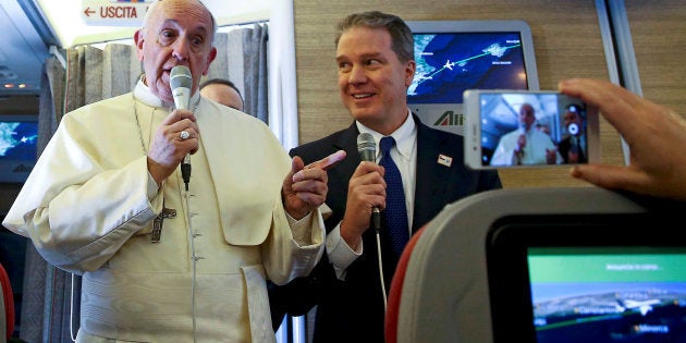 Pope Francis speaks to reporters onboard the plane for his trip to Chile and Peru January 15, 2018.