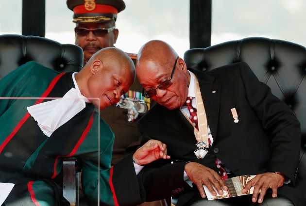 South African President Jacob Zuma (R) listens to Chief Justice Mogoeng Mogoeng ahead of Zuma's inauguration ceremony in his final term at the Union Buildings in Pretoria May 24, 2014. REUTERS/Siphiwe Sibeko (SOUTH AFRICA - Tags: POLITICS)