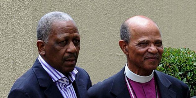 Mathews Phosa (L) and Reverend Johannes Seoka visiting the home of the late Nelson Mandela on December 7, 2013 in Johannesburg, South Africa.