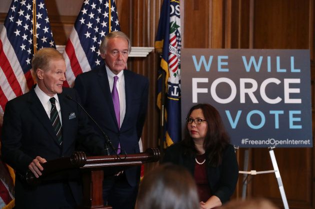 Sen. Bill Nelson (D-FL) (L) is flanked by Ed Markey (D-MA) and Tammy Duckworth (D-IL)while speaking about a Congressional Review Act (CRA) resolution that would undo action by the FCC and restore the 2015 net neutrality rules, on Capitol Hill January 9, 2018 in Washington, DC.