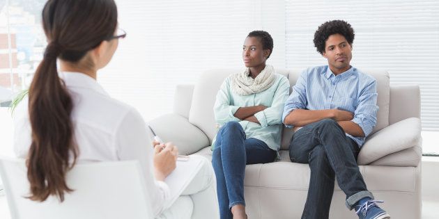 Couple not talking to each other in therapists office