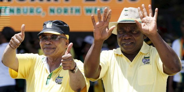 President Jacob Zuma (L), gestures next to deputy president Cyril Ramaphosa during the party's 104th-anniversary celebrations in Rustenburg. January 9, 2016.