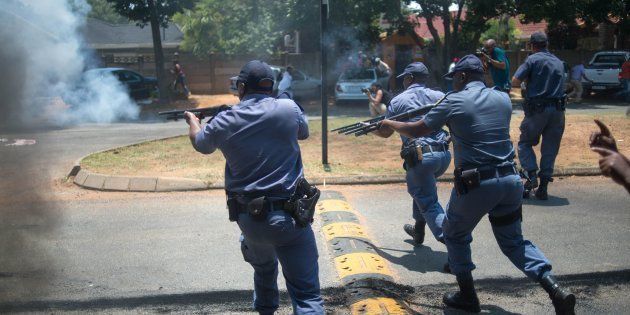 Armed police clash with protesters, including disgruntled parents, ANC supporters and EFF supporters, at Hoërskool Overvaal on January 17, 2017.