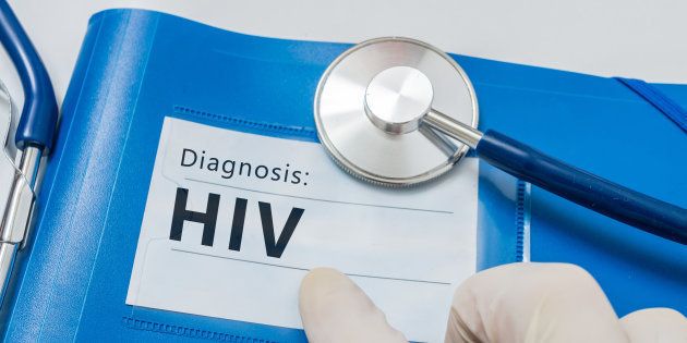 HIV diagnosis on blue folder with stethoscope.