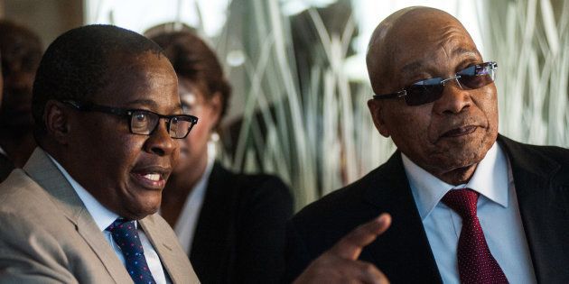 Brian Molefe, chief executive officer of Eskom Holdings SOC Ltd., left, shows Jacob Zuma, South Africa's president, around the headquarters of Eskom Holdings SOC Ltd. at Megawatt Park in Johannesburg, South Africa, on Friday, May 6, 2016. It appears to be just a matter of time before South Africas credit rating is cut to junk.