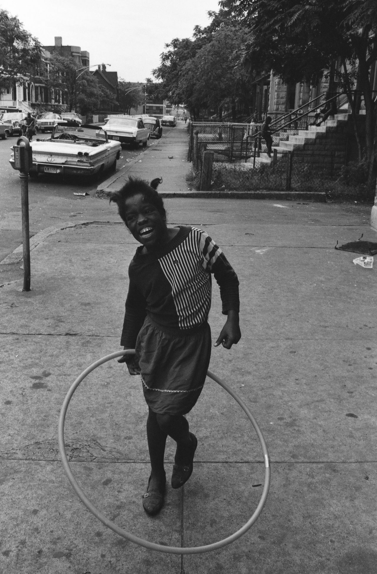 A girl twirls a toy hoop in Chicago sometime in the mid- to late 1960s.