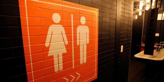 A sign is seen pointing to a gender neutral restroom in New York City, U.S., April 19, 2017.