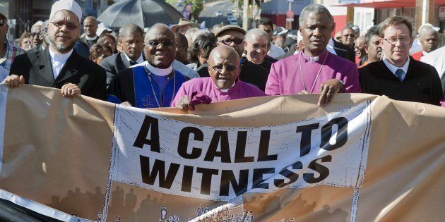 Desmond Tutu (C), Anglican archbishop emeritus, and Nobel Peace Laureate joins other religious leaders, and a wide range of people from civil society on a march called ' Procession of Witness'. On Tutu's left is current Anglican Archbishop, Thabo Makgoba.
