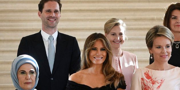 (Front row LtoR) First Lady of Turkey Emine Gulbaran Erdogan, First Lady of the US Melania Trump, Queen Mathilde of Belgium, (back row, LtoR) First Gentleman of Luxembourg Gauthier Destenay, partner of Slovenia's Prime Minister Mojca Stropnik and First Lady of Iceland Thora Margret Baldvinsdottir pose for a family photo before a diner of the First Ladies and Queen at the Royal castle in Laken/Laeken, on May 25, 2017, in Brussels. / AFP PHOTO / BELGA / YORICK JANSENS / Belgium OUT (Photo credit should read YORICK JANSENS/AFP/Getty Images)