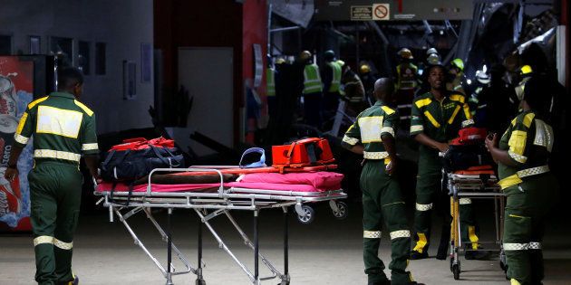 Paramedics arrive at a site of a roof collapse at Johannesburg's Charlotte Maxeke state hospital in Johannesburg, South Africa, March 2, 2017.