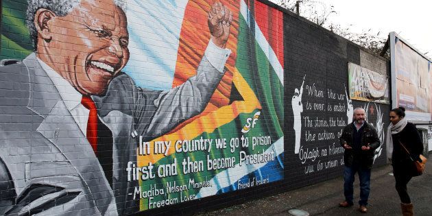 A mural to Nelson Mandela in west Belfast as First Minister Peter Robinson paid tribute to the former South African leader's humility and charisma following his death at the age of 95.