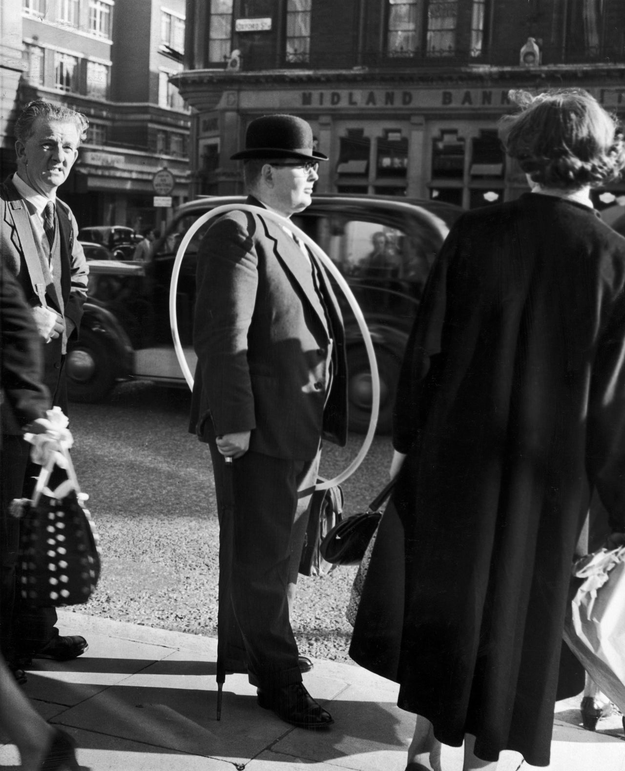 A man with a toy hoop he bought at Selfridges in London, 1958.