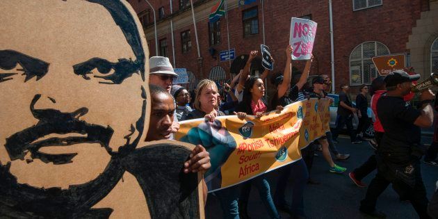 Thousands march through Cape Town's city centre on April 7 2017, calling for President Jacob Zuma to step down.