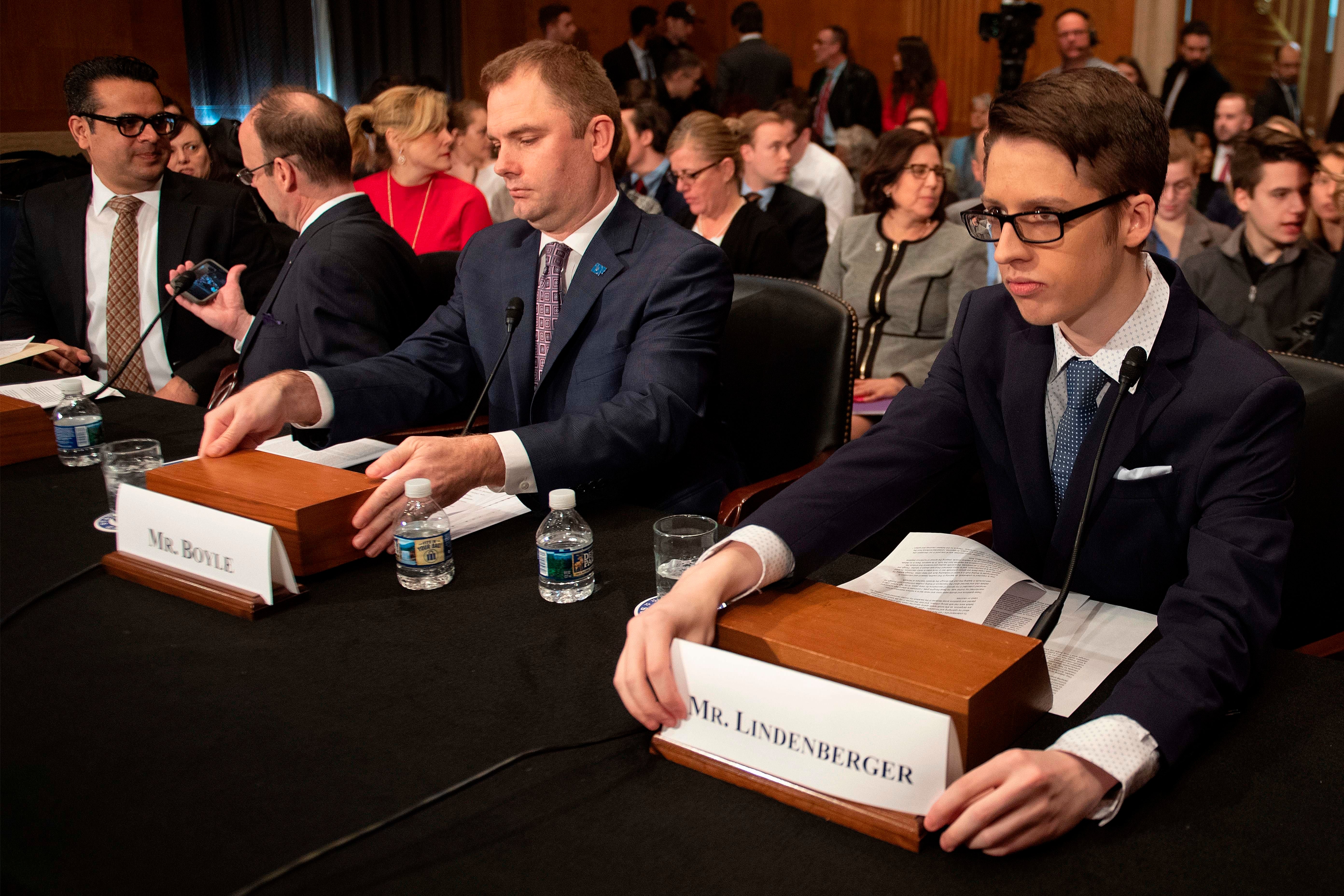 CEO of the Immune Deficiency Foundation John G. Boyle, center, and Ethan Lindenberger (R), student at Norwalk High School in Norwalk, Ohio, who confided in a now-viral Reddit post that he had not been fully vaccinated due to his mother's belief that vaccines are dangerous, speaks before the Senate Committee on Health, Education, Labor and Pensions on Capitol Hill in Washington, DC, on March 5, 2019. (Photo: Jim Watson/AFP/Getty Images)