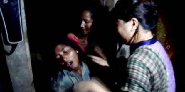 A woman cries following landslides triggered by heavy rain in Khagrachari, Bangladesh, in this still frame taken from video June 13, 2017.