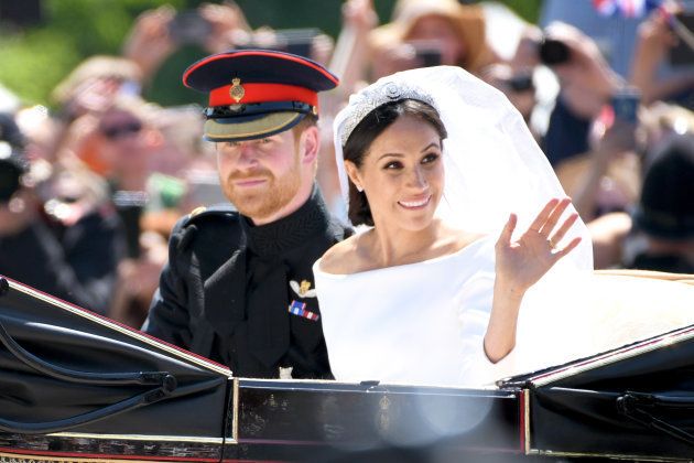 The Duke and Duchess of Sussex leave Windsor Castle in the Ascot Landau carriage during a procession after getting married at St George's Chapel on May 19.