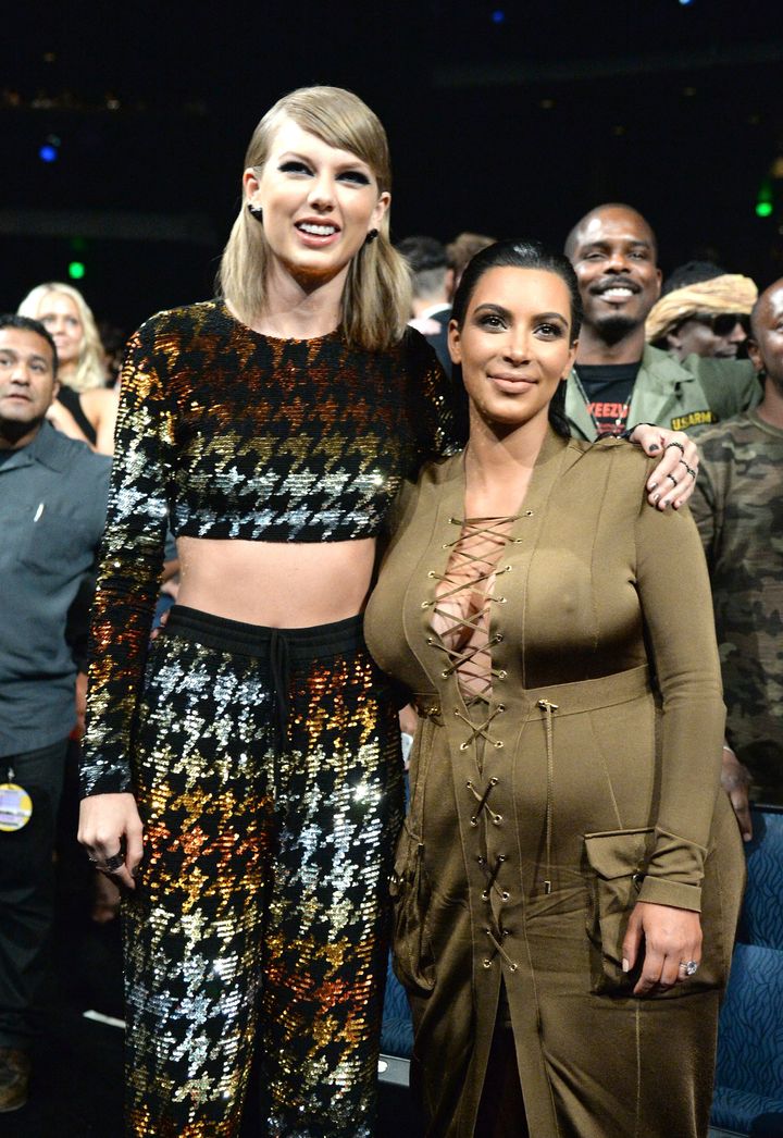 Taylor Swift and Kim Kardashian pose together pre-feud at the 2015 MTV Video Music Awards. 